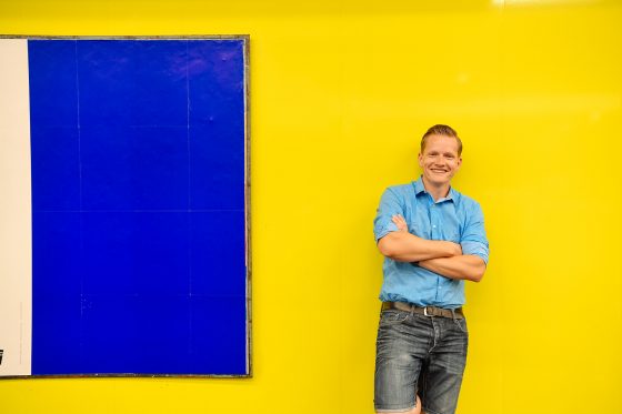 Stefan Pasch in front of a yellow wall