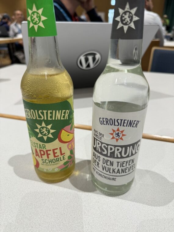 a close up of two bottle of Gerolsteiner drinks