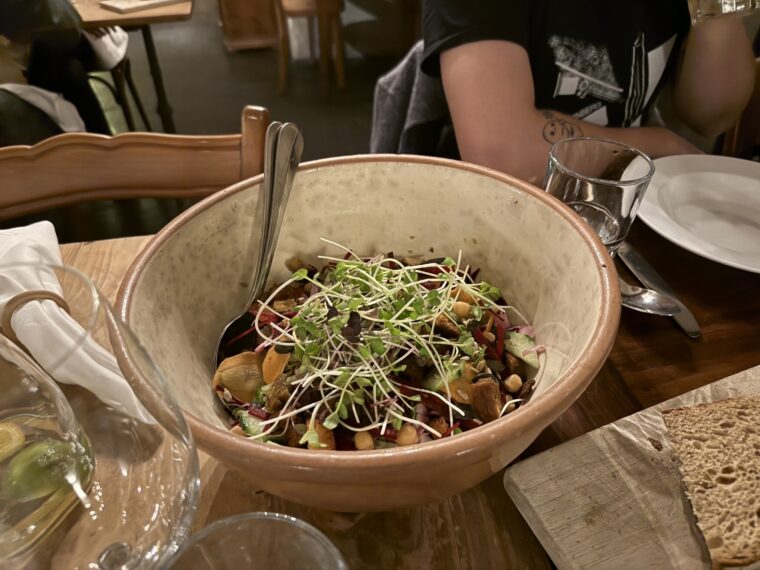 a bowl of food sitting on a table